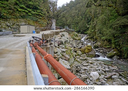 GREYMOUTH, NEW ZEALAND, MAY 20, 2015:  Pike River flows past the entrance to Pike River Coal mine near Greymouth, New Zealand. 29 miners died at the mine  in 2010 and it cannot be reopened.