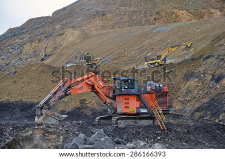 WESTPORT, NEW ZEALAND, MARCH 4, 2015:Machinery at work at an open cast coal mine on March 4, 2015 near Westport, New Zealand