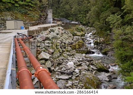 GREYMOUTH, NEW ZEALAND, MAY 20, 2015:  Pike River flows past the entrance to Pike River Coal mine near Greymouth, New Zealand. 29 miners died at the mine  in 2010 and it cannot be reopened.