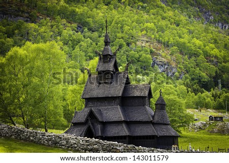 A shot of the stave church of Borgund, showing the woods around.