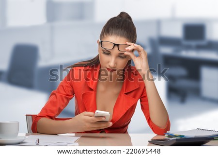 Young woman secretary at work at the office