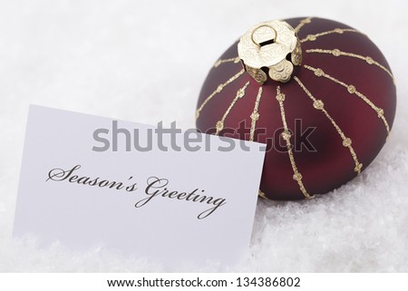 Christmas Ornaments with card and words \'season\'s greeting\'