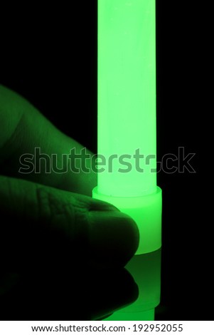 2 fingers holding glow stick