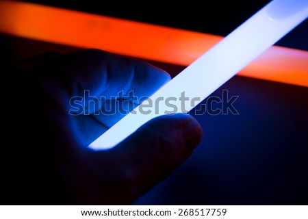 Glow sticks with hand holding