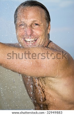 Man having fun under a shower.