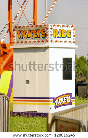 Ticket Booth sells tickets for rides at a rural carnival.