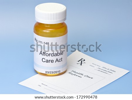 Affordable Care Act prescription bottle on blue with prescription for health care reform.