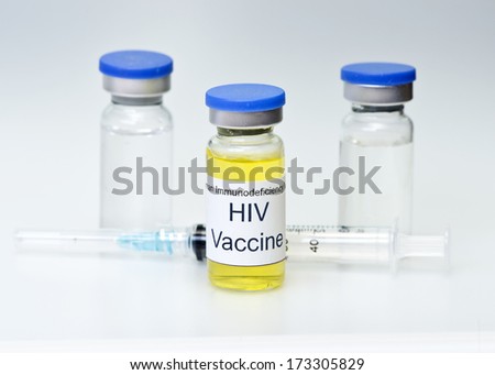 Hypothetical AIDS/HIV vaccine with syringe and vials.