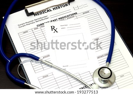 Blank prescription pad with patient medical chart and stethoscope.