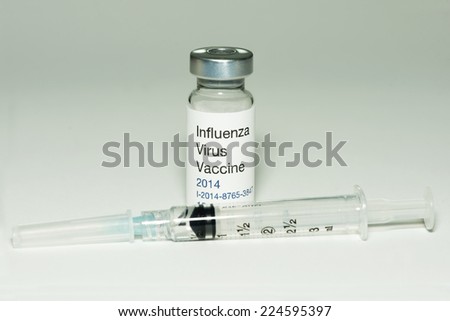 2014 Influenza flu vaccine with syringe.