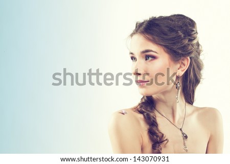 young girl with butterfly on her shoulder