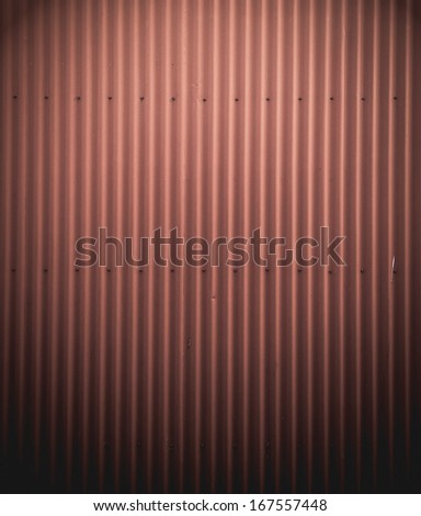 Red painted corrugated iron; red vertical stripe texture/background.