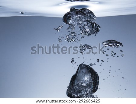 Air bubbles in water, similar to the liquid metal