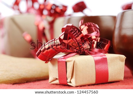 Small wrapped gifts with brown paper and red cords
