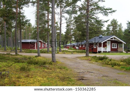 Red small cottages to rent in a holiday park