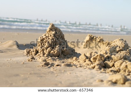 Sand castle, focus on the castle, room for copy