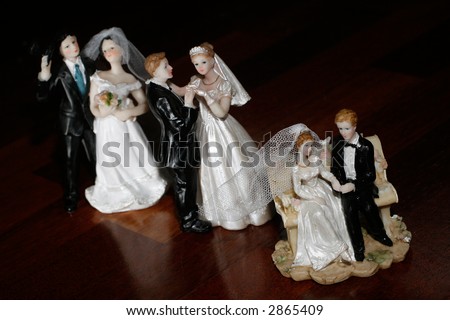 Three couples - bride and groom dolls