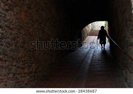 Path of life - an old aged woman walking(silhouette)