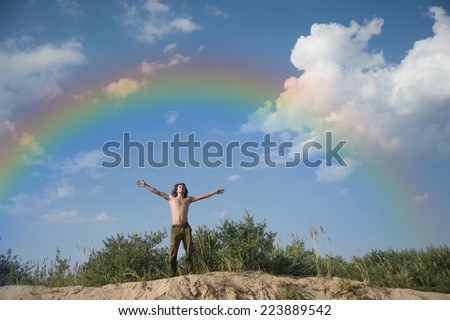 beautiful happy man  outstretched arms in the summer
