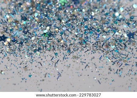 Blue and Silver Frozen Snow Winter Sparkling Stars Glitter background. Holiday, Christmas, New Year abstract texture