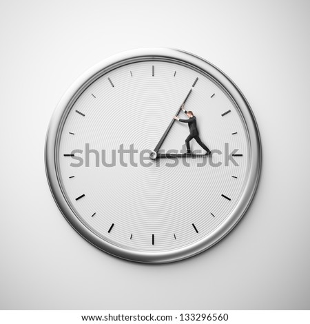 Clock On The Wall With Businessman Trying To Stop Time