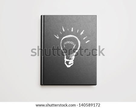 idea bulb sign drawn on book cover
