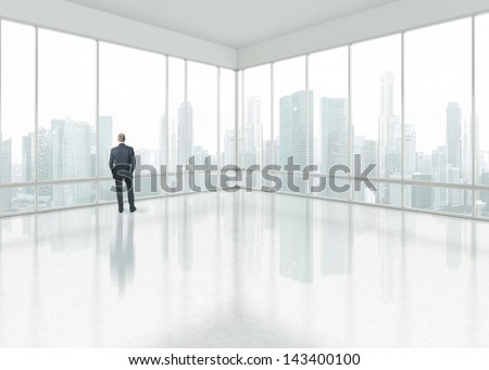 Businessman Looking Through The Window