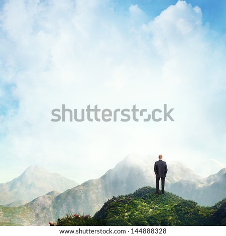 Man Standing On A Peak