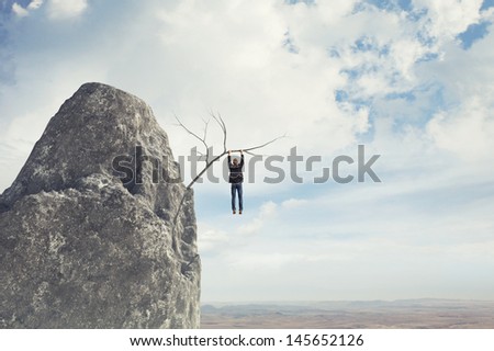 risky man climbs a mountain