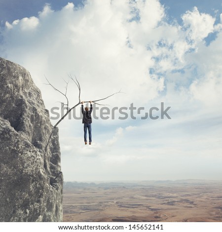 man climbs a mountain
