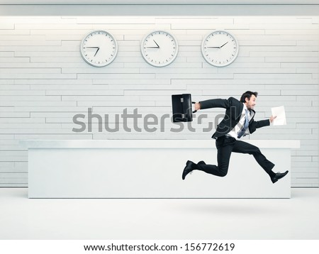 Office Interior With Running Businessman