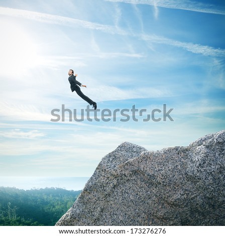 Man In Suit Flying Over Mountains