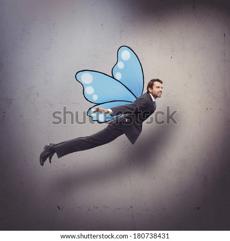 Businessman flying like butterfly