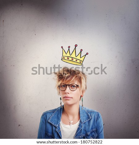 Upset young woman with little crown