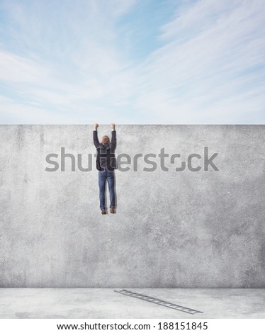 man hangs on a wall