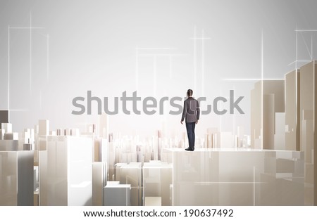 Businessman looking modern city project