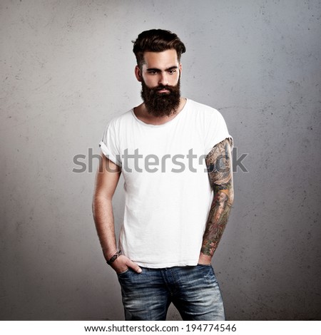 Tattooed brutal man wearing white blank t-shirt