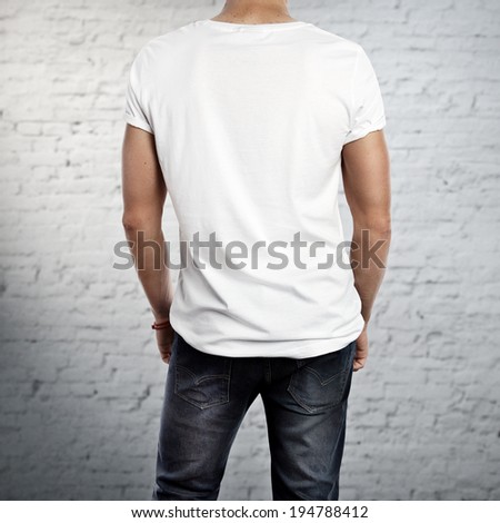 Young man wearing white t-shirt. Back.