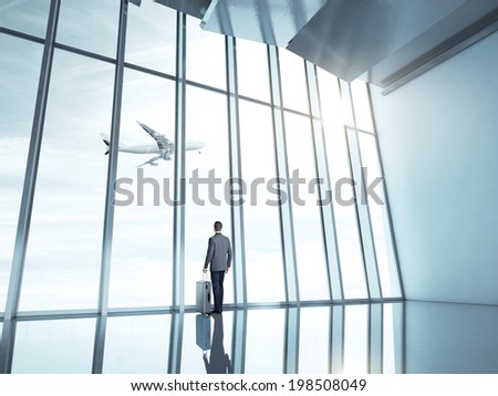 Man at airport with suitcase