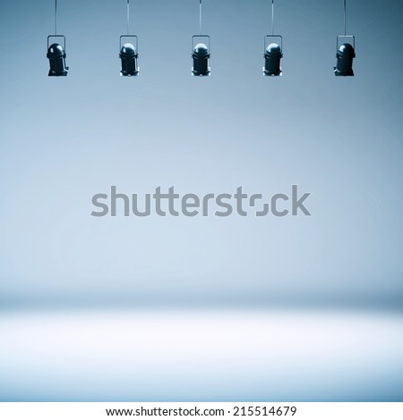 Empty photo studio background with lamps and spotlights