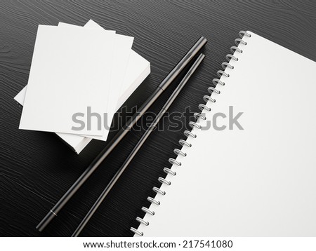 Blank branding elements on the black wooden background