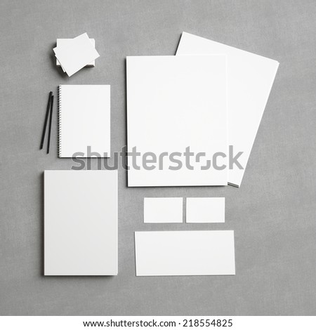 Set of white branding elements on fabric background