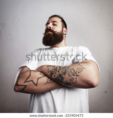 Brutal bearded man wearing white t-shirt