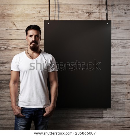 Bearded man and black banner on a wood wall