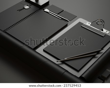 Set of black branding elements on black paper background