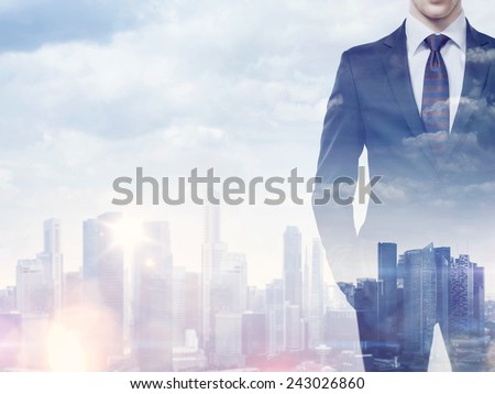Double exposure of businessman and city