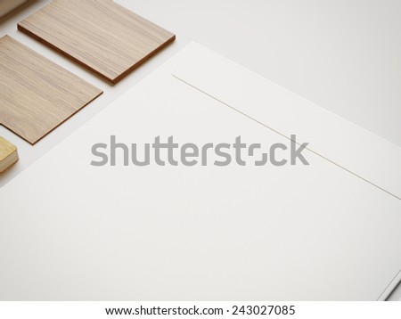 White envelope and wood cards on white paper background