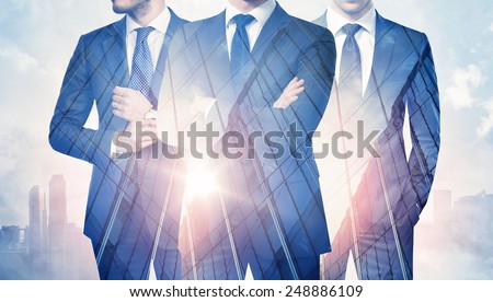 Double exposure of businessmen and skyscraper on megalopolis background