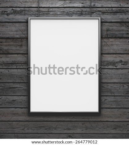 Black frame with blank canvas on the vintage wood background