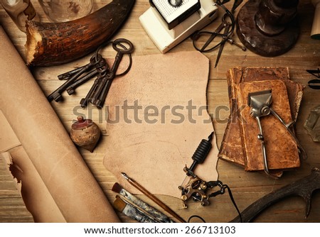 Set of old-fashioned elements with piece of leather and tattoo machine